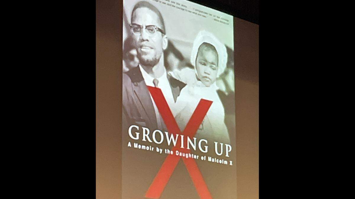The cover of a book by Ilyasah Shabazz, daughter of slain civil rights leader Malcolm X, was projected on a large screen at Modesto Junior College on Feb. 7, 2026.