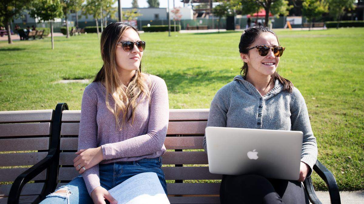 Stanislaus State biology and psychology major Mireya Magana, right, and business student Jaclyn Sammuli, left, speak to the Bee about registering to vote on Thursday in Turlock Oct. 11, 2018.