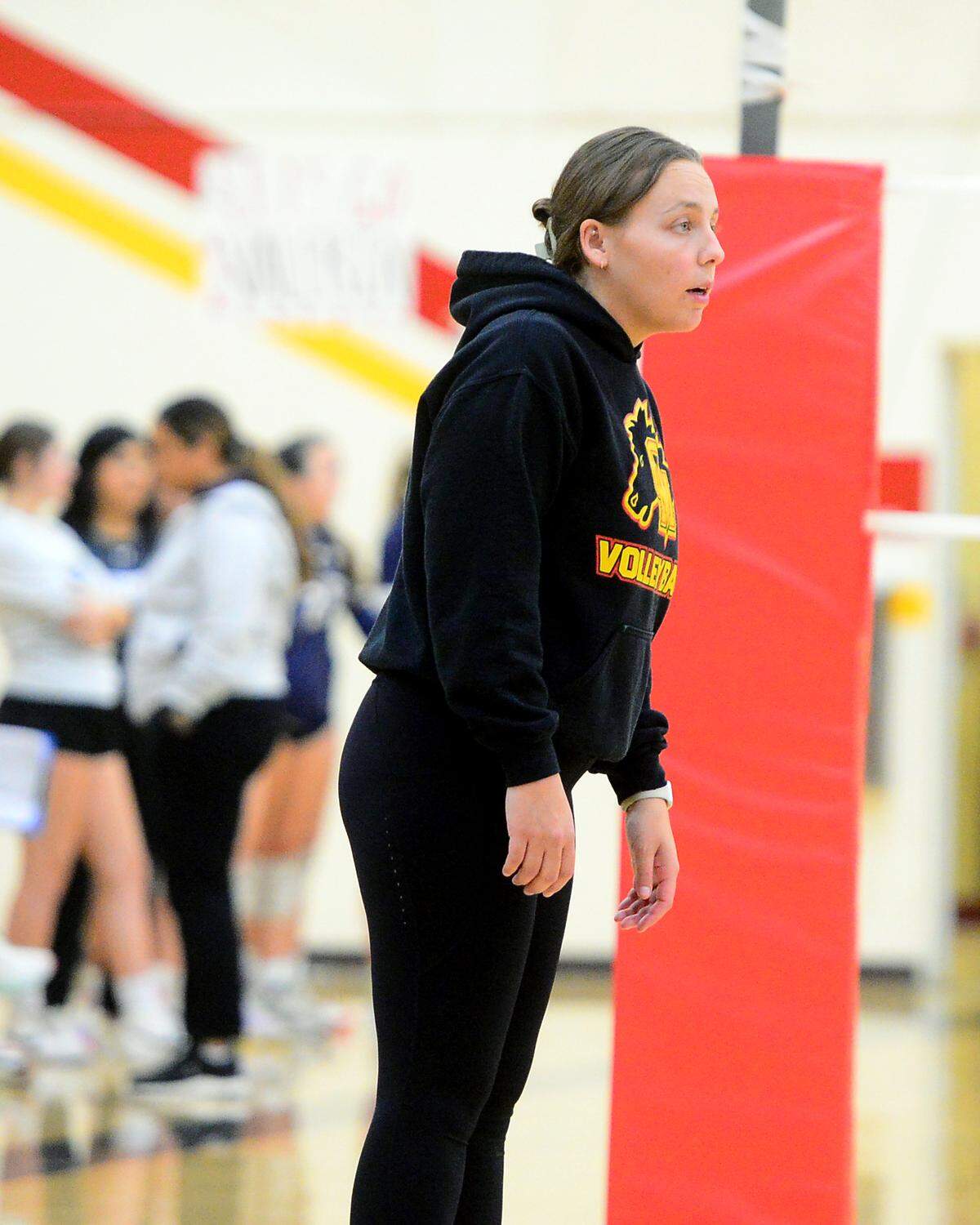 Oakdale volleyball head coach Kaitlin Burke talks to her players from the sidelines during a game between Oakdale and Central Catholic at Oakdale High School in Oakdale, Calif. on Thursday, Oct. 17, 2024.&nbsp;