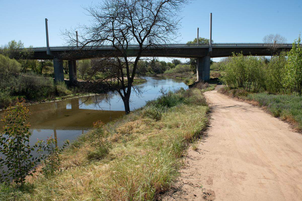 The Tuolumne River and the 9th Street bridge from Gateway parcel in Tuolumne River Regional Park in Modesto, Calif., on Tuesday, March 22, 2022.