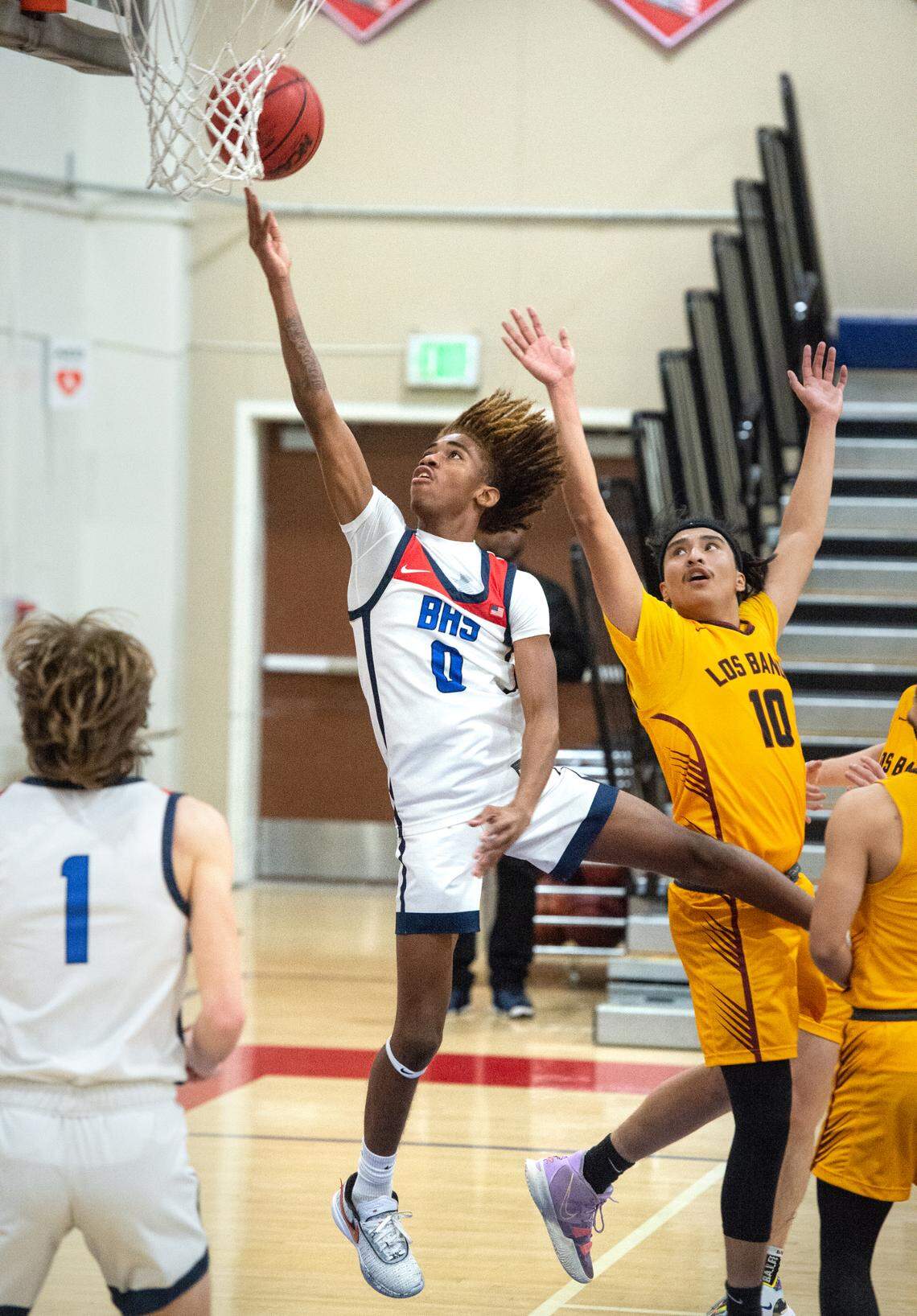 Beyer’s Prince Major scores past Los Banos’ Angel Resendiz during the Western Athletic Conference game at Beyer High School in Modesto, Calif., Wednesday, Jan. 4, 2023.