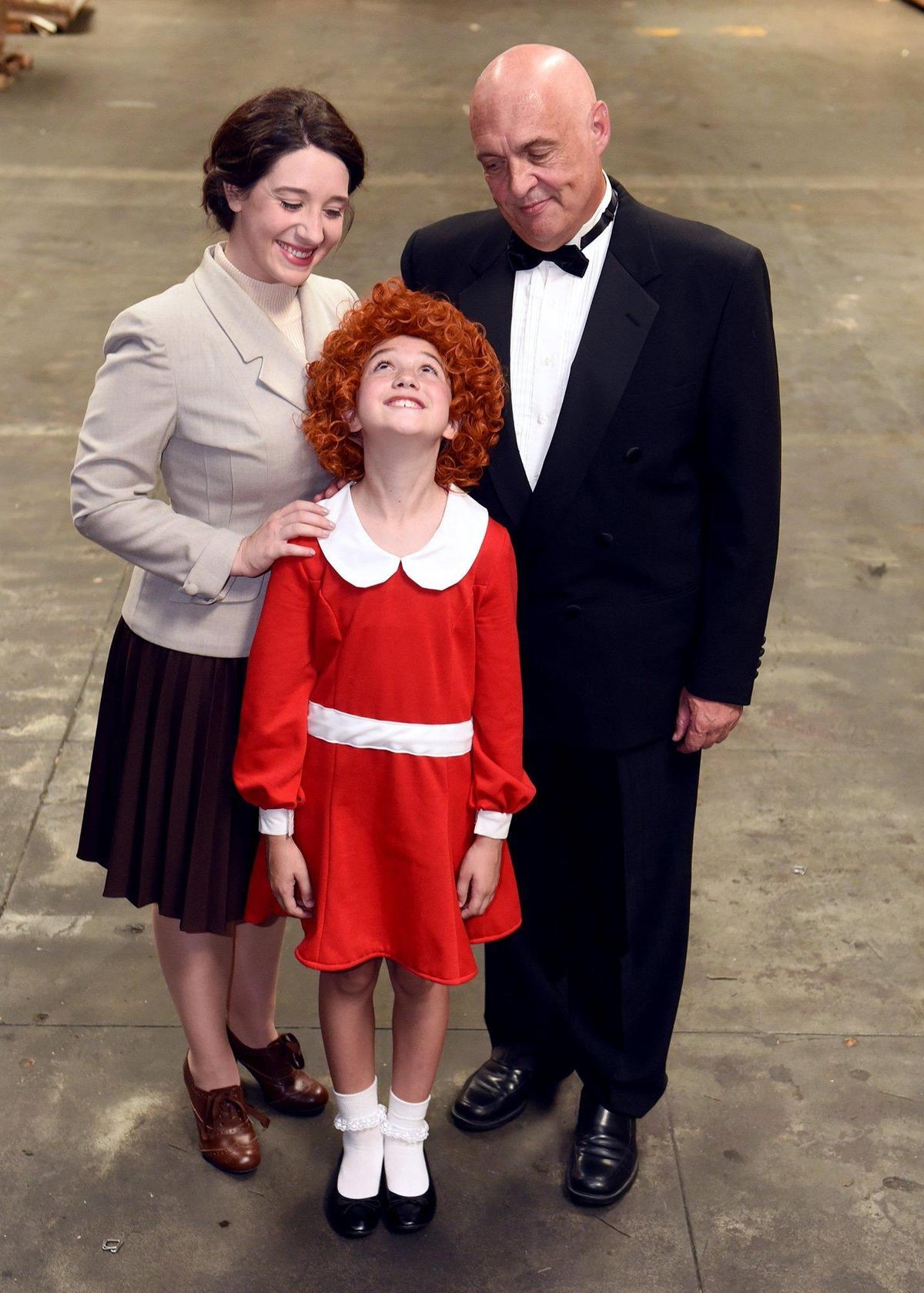 Erin Rieger as Annie, Natalie Woodfield as Grace Farrell and Ron Smith as Daddy Warbucks prepare for the Modesto Performing Arts production of Annie on Tuesday afternoon June 11, 2019.