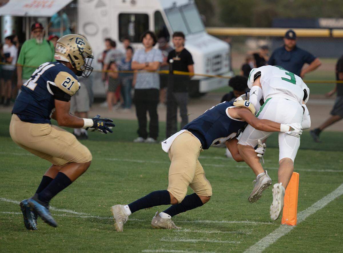 Central Catholic’s Sebastian Guzman knocks St. Mary’s Brooks Wheatley out of bounds short of the goal during the non-league game at Central Catholic High School in Modesto, Calif., on Friday, September 2, 2022.