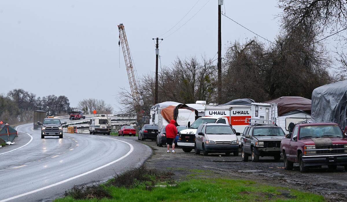 Catfish Camp RV park residents have moved their trailers and RV’s up to Crows Landing Road as the San Joaquin River threatens to flood the park north of Newman, Calif., Wednesday, Jan. 11, 2023.