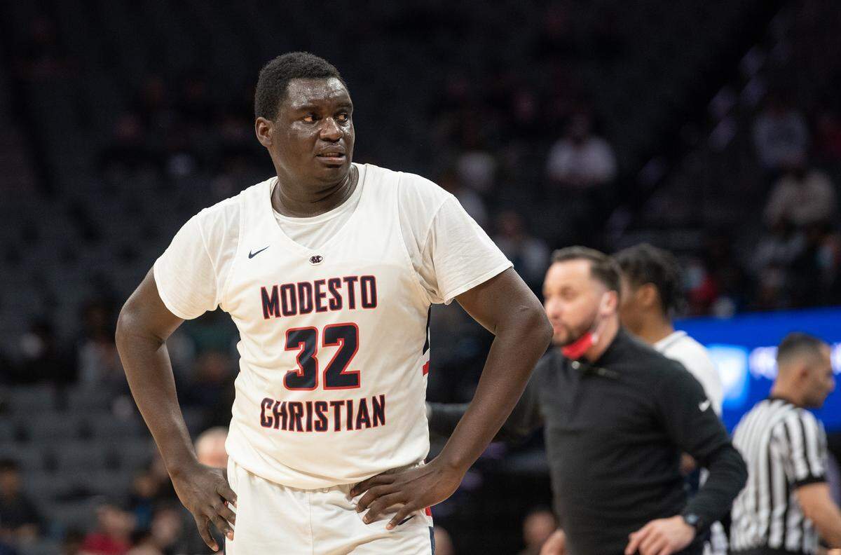 Modesto Christian’s Manasse Itete struggled with an injury during fourth quarter of the boys Open Division CIF State Basketball Championship game with Centennial at Golden 1 Center in Sacramento, Calif., on Saturday, March 12, 2022. Centennial won the game 59-50.