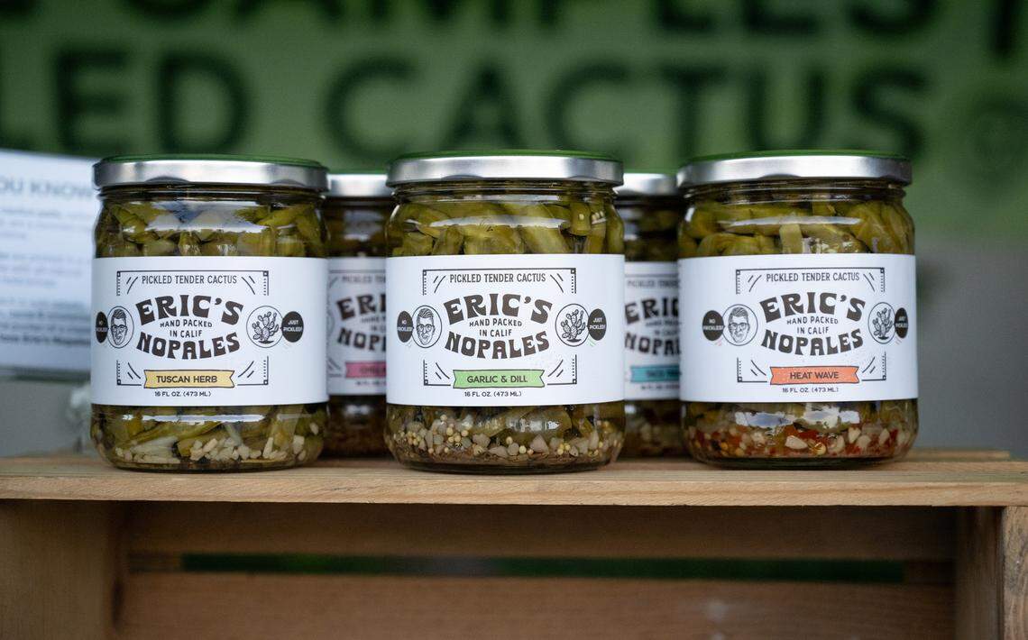 Jillian Ruiz talks with friends as she sells pickled nopales (Eric’s Nopales) at the Ripon Farmers Market in Ripon, Calif., Thursday, Sept. 19, 2024. Ruiz and her husband Eric created a line of pickled nopales cactus.