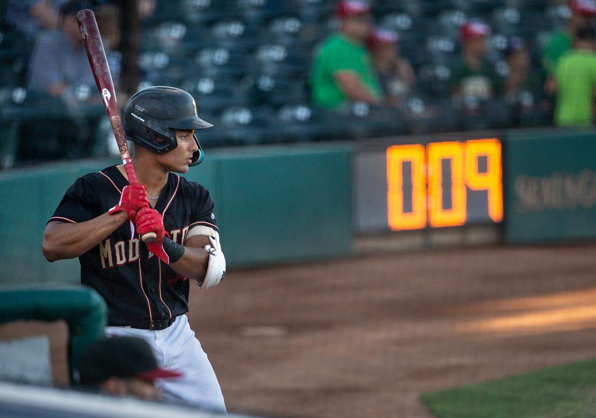 Modesto Nuts’ Harry Ford prepares to bat in the on-deck circle during the California League game with the Stockton Ports at John Thurman Field in Modesto, Calif., on Wednesday, July 6, 2022.