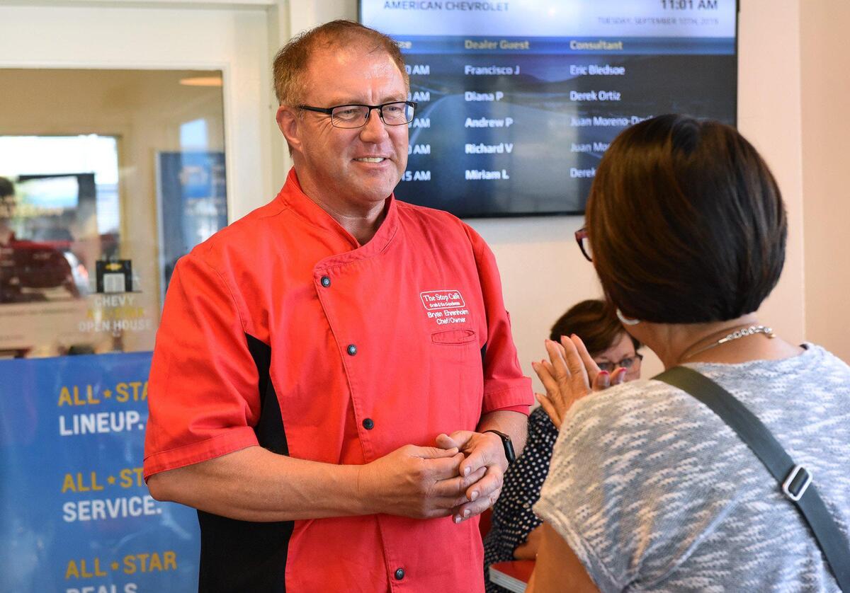 Owner/Chef Bryan Erenholm talks with a customer at Stop Cafe on Tuesday morning September 10, 2019 in Modesto, Calif.