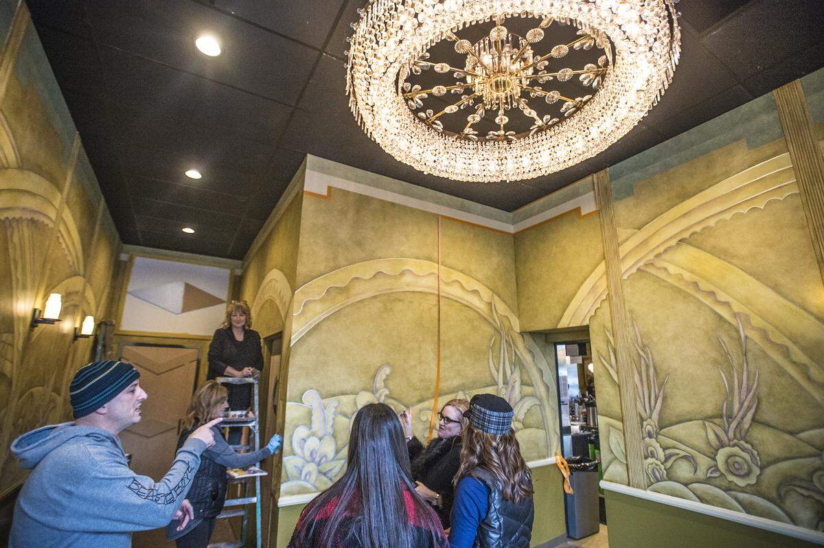 Kirstie Boyett (second from right) tours the new theater with Paradigm Construction owner Danny Savage (left) and his family, at the State Theatre on Saturday, Dec. 21, 2019, in Modesto, California.