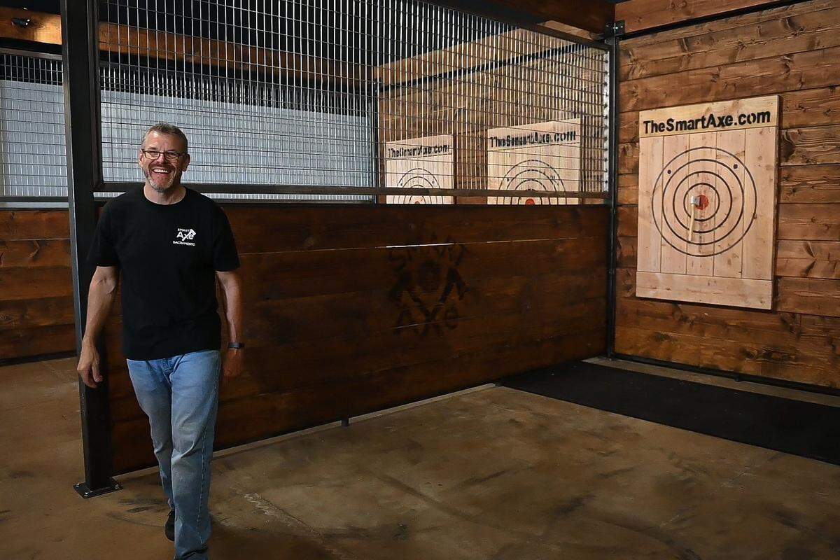 Smart Axe owner and general manager Doug Link hits a bullseye after demonsrtating axe throwing on Thursday, June 13, 2019. Smart Axe is a new bar in Rancho Cordova, California featuring axe throwing.