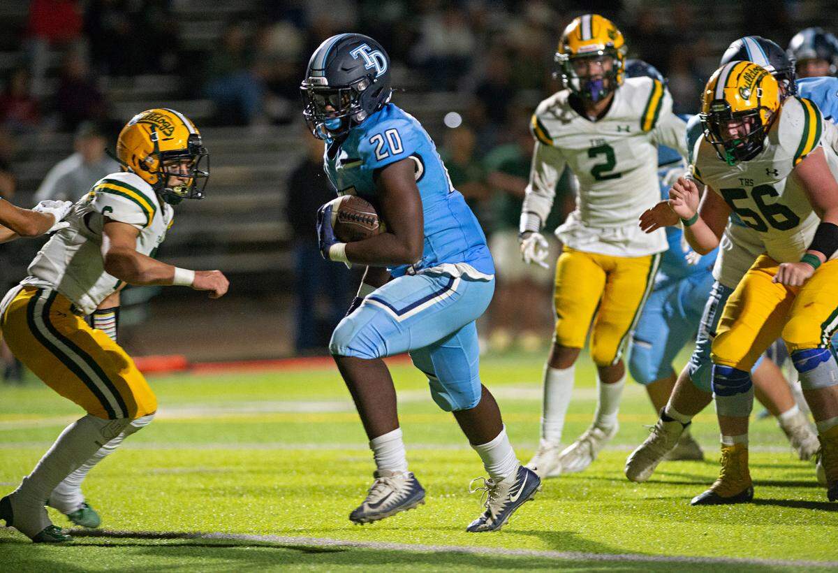 Downey’s Ki Ragland scores on a short run during the nonleague game with Tracy at Downey High School in Modesto, Calif., on Friday, September 16, 2022. Ragland had two rushing touchdowns in Downey’s 24-13 victory.