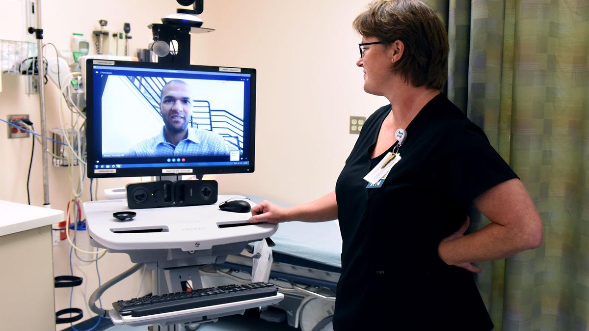 Registered nurse manager Karen Turner shows a demonstration of the tele psychiatric station Monday August 27, 2018 with program manager Timothy W. Jones at Memorial Medical Center in Modesto, Calif. The hospital is using tele psychiatry with Skype to evaluate patients experiencing psychiatric episodes who come to the hospital. The service assist with evaluations, prescribing medicine and referrals to outpatient care.