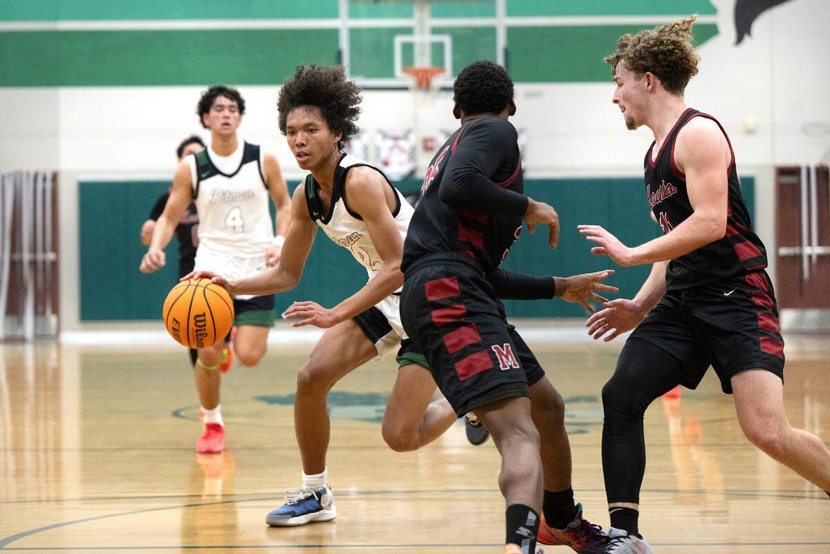 Pitman’s Cole Martin moves the ball during the Central California Athletic League game with Modesto in Turlock, Calif., Friday, Jan. 26, 2024.