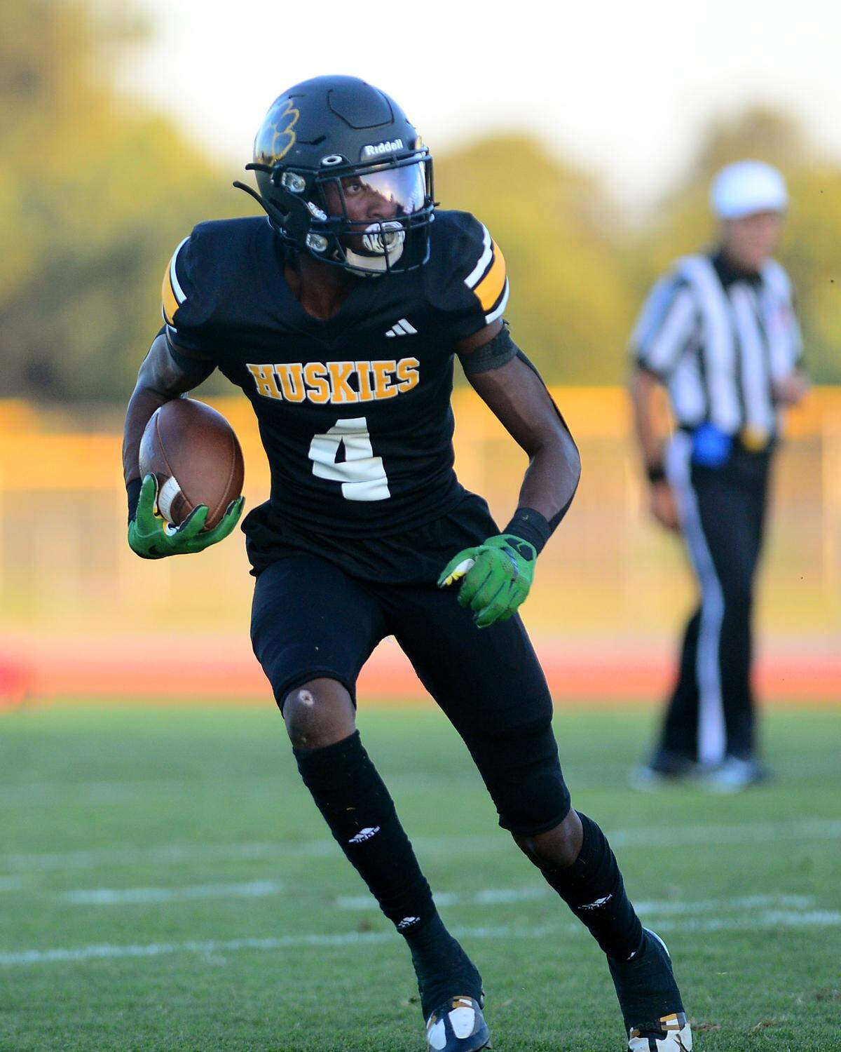 Hughson receiver Malakai Sumter runs up field after making a catch during a game between Hughson High School and Central Valley High School at Hughson High School in Hughson California on August 25, 2023.