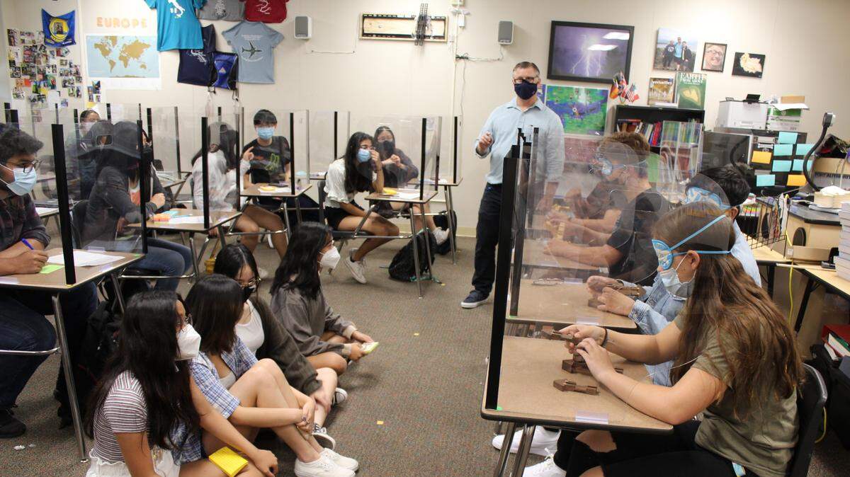 High school students in an AP history summer session at James C. Enochs High School participate in a team-building activity.
