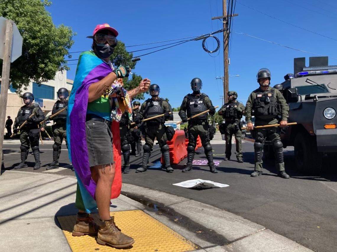 Modesto police move in after declaring an unlawful assembly during protests Saturday on McHenry Avenue. Aug. 27, 2022.