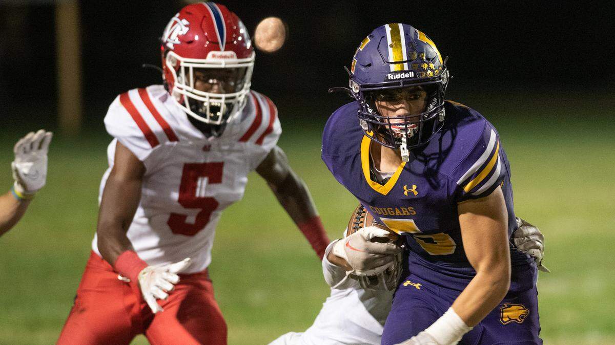 Escalon’s Logan Anderson runs trough the tackling of Modesto Christian’s Jeremiah Bernard during the Trans-Valley League game in Escalon, Calif., Thursday, Oct. 6, 2022. Escalon won the game 62-30.