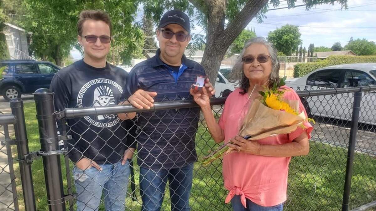 Gary Curiel and son Ayden drove down to Modesto from their Elk Grove home on Sunday, May 17, 2020, to get back Gary’s Ceres High School class ring, which he lost just a week or two after graduating in 1989. Carmen Rodriguez, whose husband, Joe, found it back then, had kept it safe and with her daughter’s help finally was able to figure out who owned it.