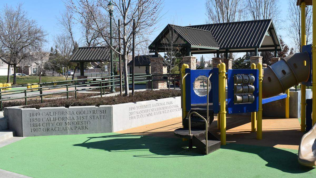 A playground wall at Sanders Neighborhood Park is imprinted with historic dates including Modesto’s incorporation year and the opening of the park.