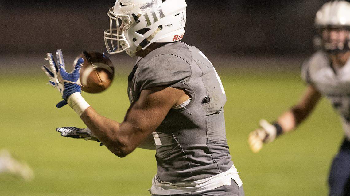 Modesto’s Payton Bass makes a catch during the CCCAA NorCal Regional Semifinal game with American River College at Modesto Junior College in Modesto, Calif., Saturday, Nov. 23, 2019. Modesto won the game 35-28.