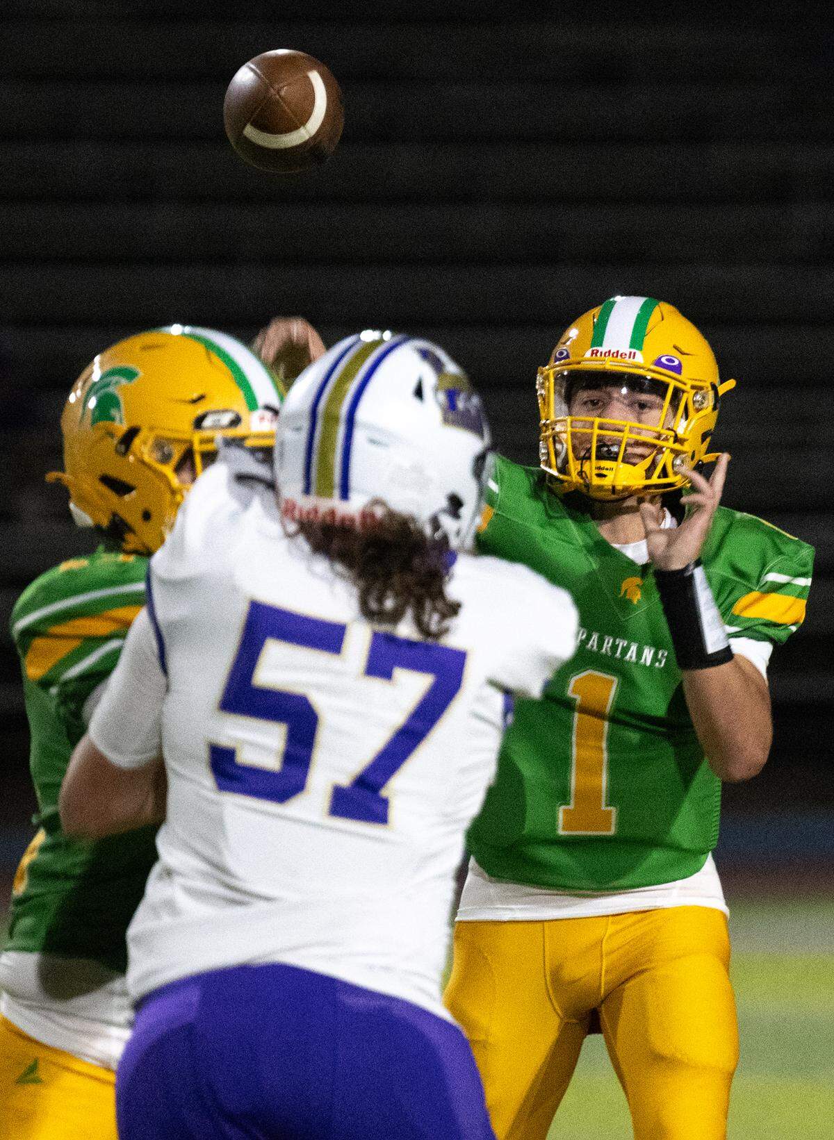 Davis quarterback Caleb Zaragoza throws a pass during the Western Athletic Conference game with Livingston at Downey High School in Modesto, Calif., Thursday, Oct. 3, 2024.