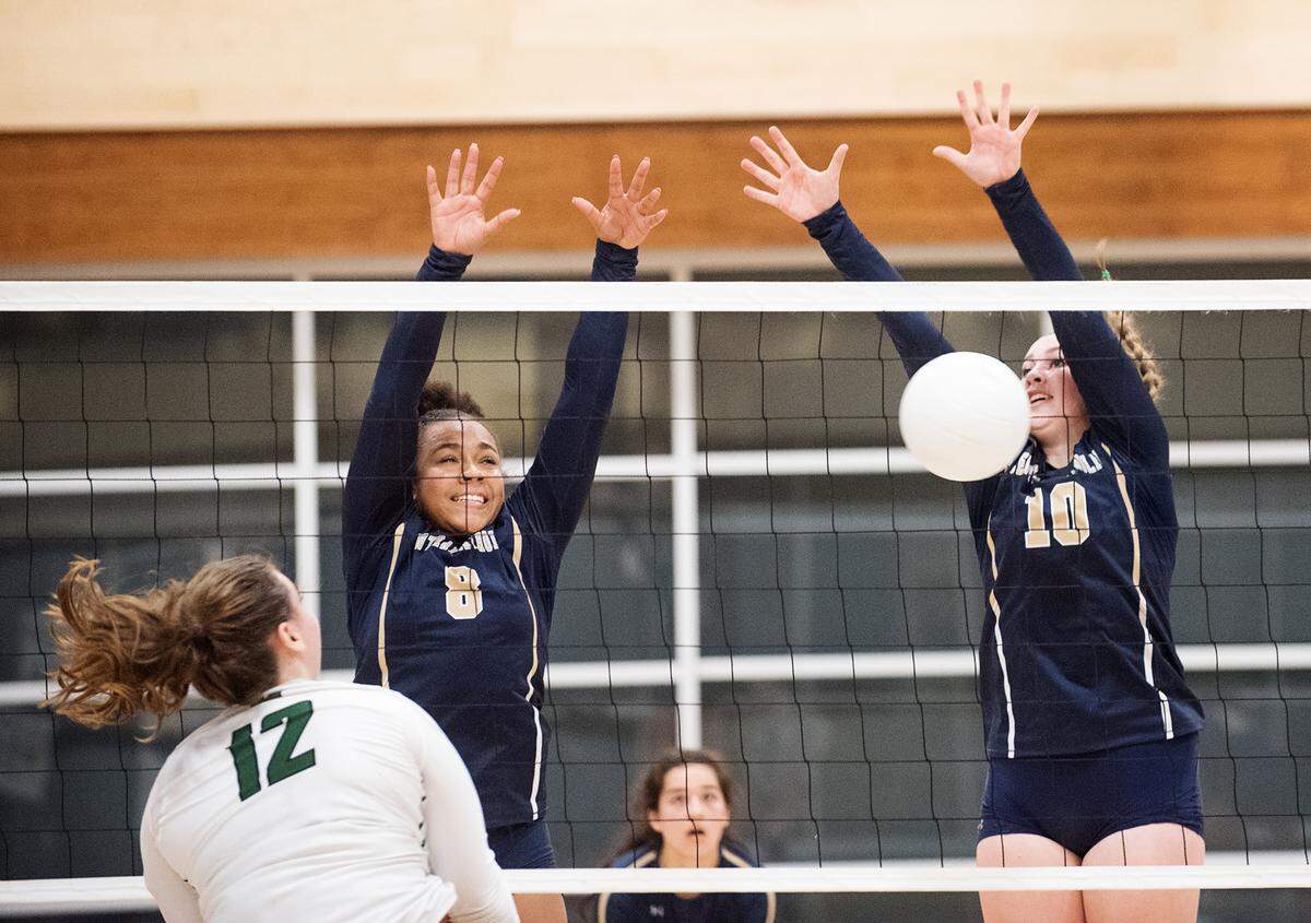 Central Catholic’s Cameron Sauls (10) blocks the ball from Manteca’s Kaitlyn Morenzone (12) during the Valley Oak League match with Manteca at Central Catholic High School in Modesto, Calif., on Thursday, Oct. 4, 2018.
