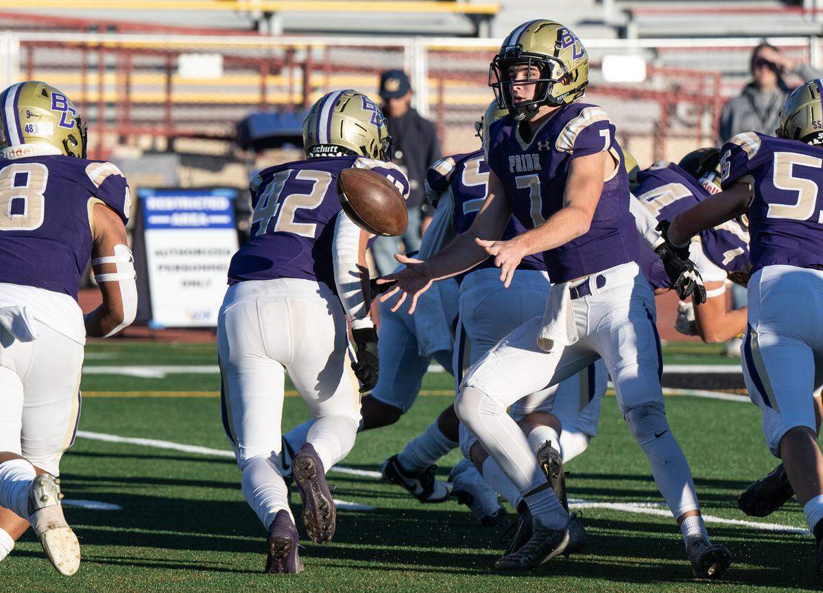 Bradshaw Christian quarterback Ethan Rickert pitches the ball to Mateo Mojica during the Sac-Joaquin Section Division VI championship game with Hughson at Sacramento City College in Sacramento, Calif., Saturday, Nov. 25, 2023.
