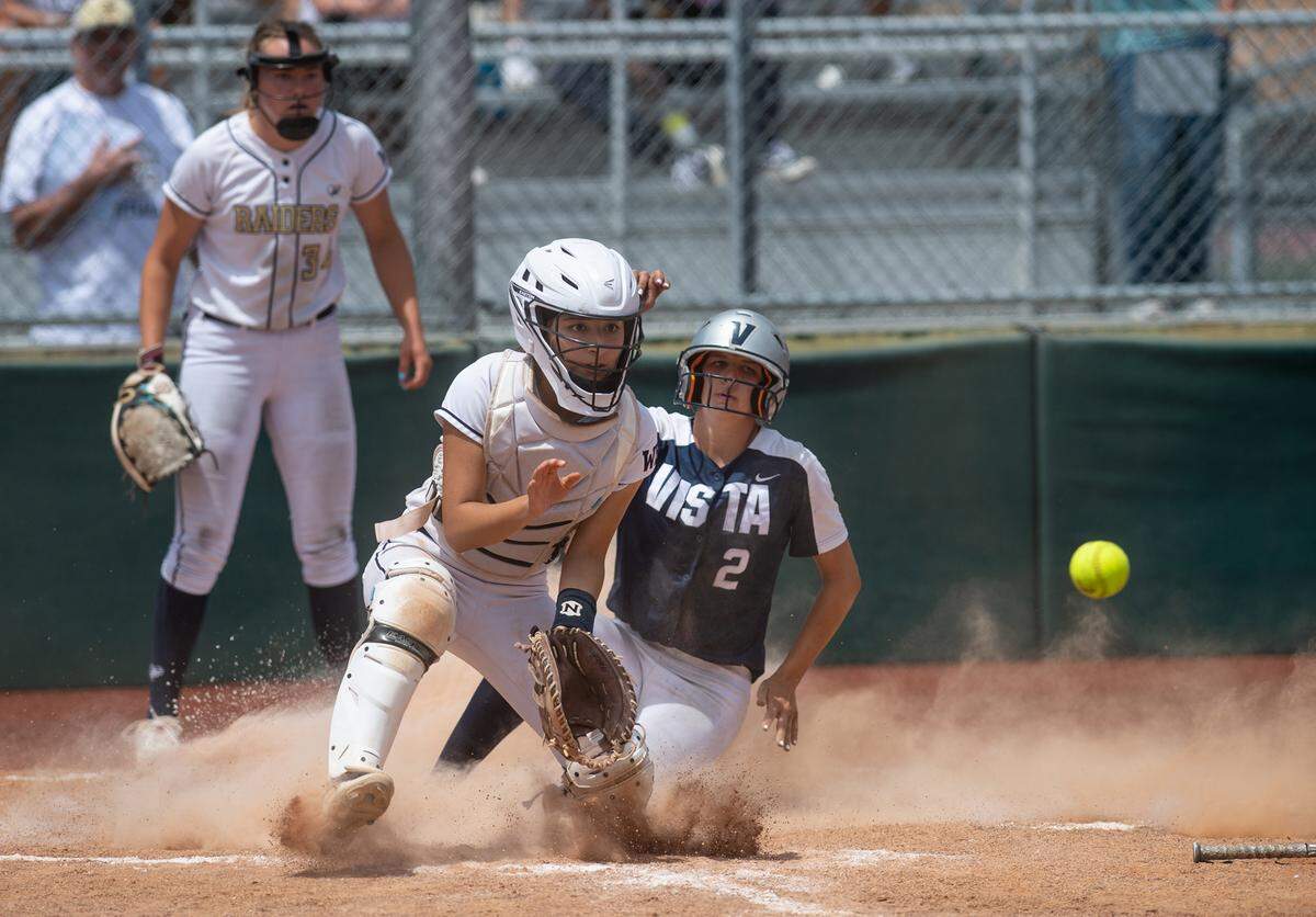Vista del Lago’s Tayler Biehl beats the throw to Central Catholic’s Noelany Ramirez on a sacrifice fly during the CIF Sac-Joaquin Section Division III softball championship game at Delta College in Stockton, Calif., on Saturday, May 28, 2022.