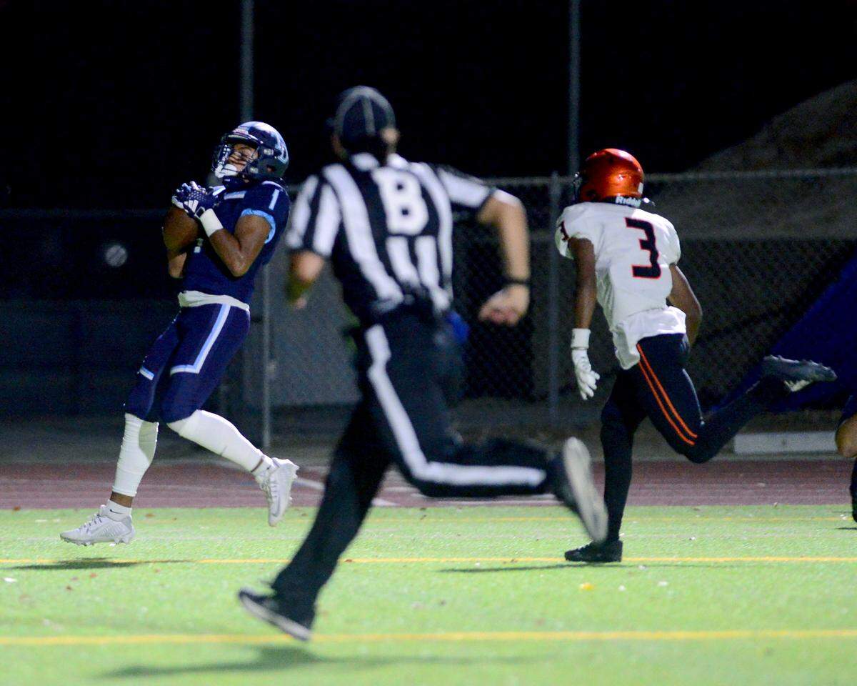 Downey receiver Nathan Dip (1) catches a touchdown pass during a game between Downey High School and Merced High School at Downey High School in Modesto California on September 1, 2023.