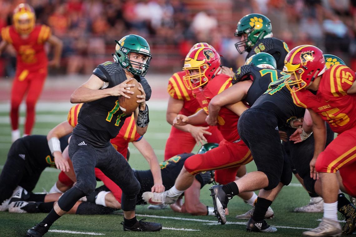 Sonora quarterback Jake Gookin looks to run during the non-conference league game with Oakdale in Oakdale, Calif., Friday, August 17, 2018. Oakdale won the game 49-0.