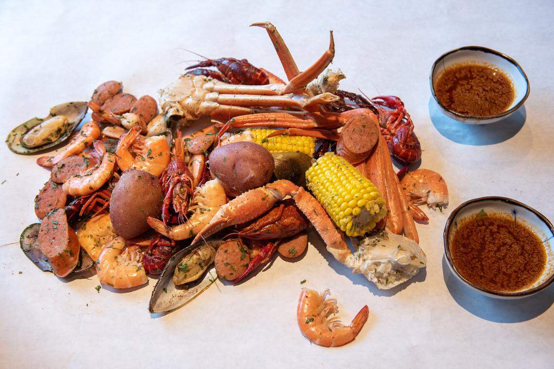 Party for 2 is to be eaten off paper covered table at Akitaca Crab seafood restaurant in Modesto, Calif., on Wednesday, March 16, 2022.