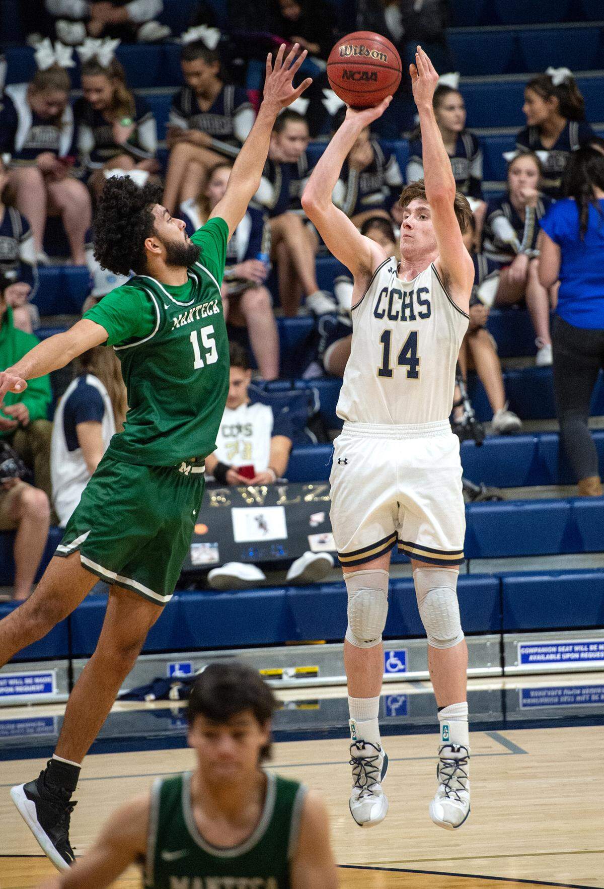 Central Catholic’s Wesley Payne attempts a shot over Manteca’s Mehtaj Mehrok during the Valley Oak League game at Central Catholic High School in Modesto, Calif., on Wednesday, Feb. 9, 2022. Manteca won the game 39-33.