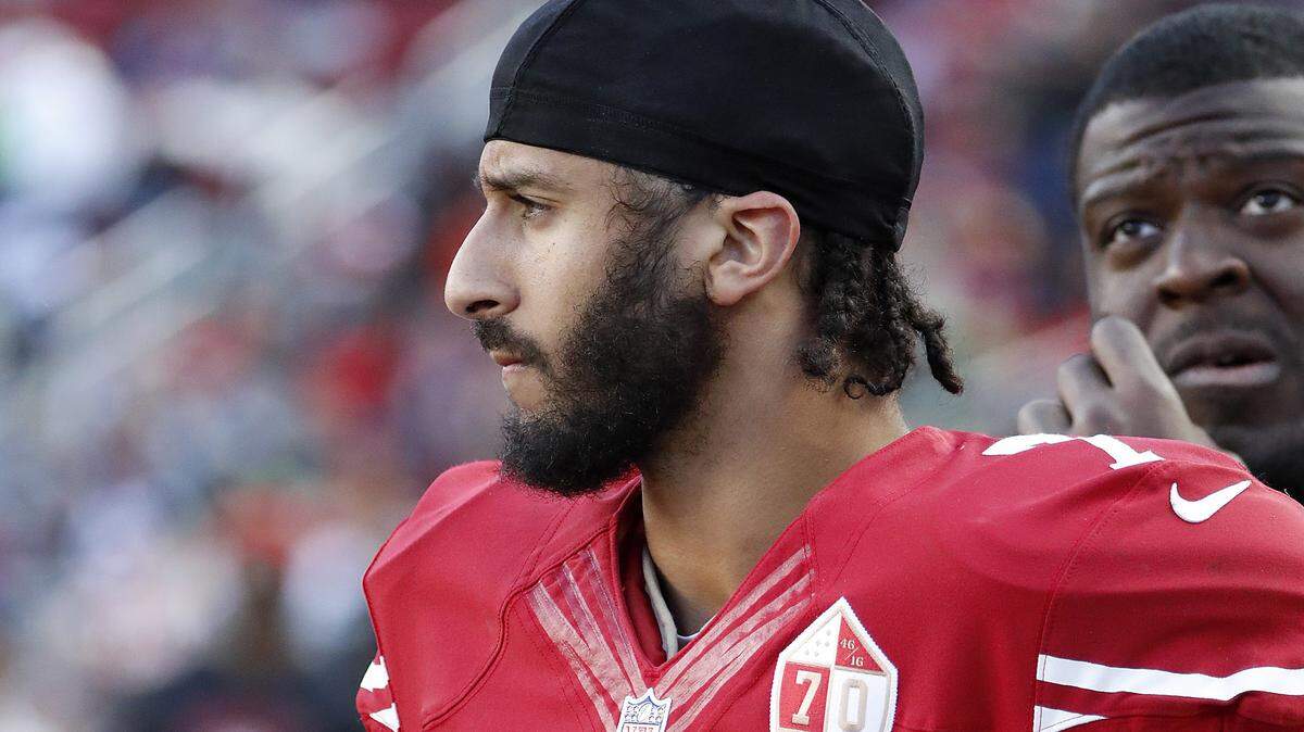 Colin Kaepernick, seen here on Jan. 1, 2017, on the sideline of a San Francisco 49ers game at Levi's Stadium n Santa Clara, has completed his million-dollar pledge to community groups.
