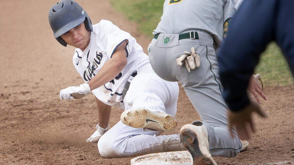Central Catholic’s Matt Akulow steals third base as Sonora’s Jacob Neilson fields the throw during the Sac-Joaquin Section Division IV playoff game with Sonora in Modesto, Calif., Thursday, May 16, 2019.
