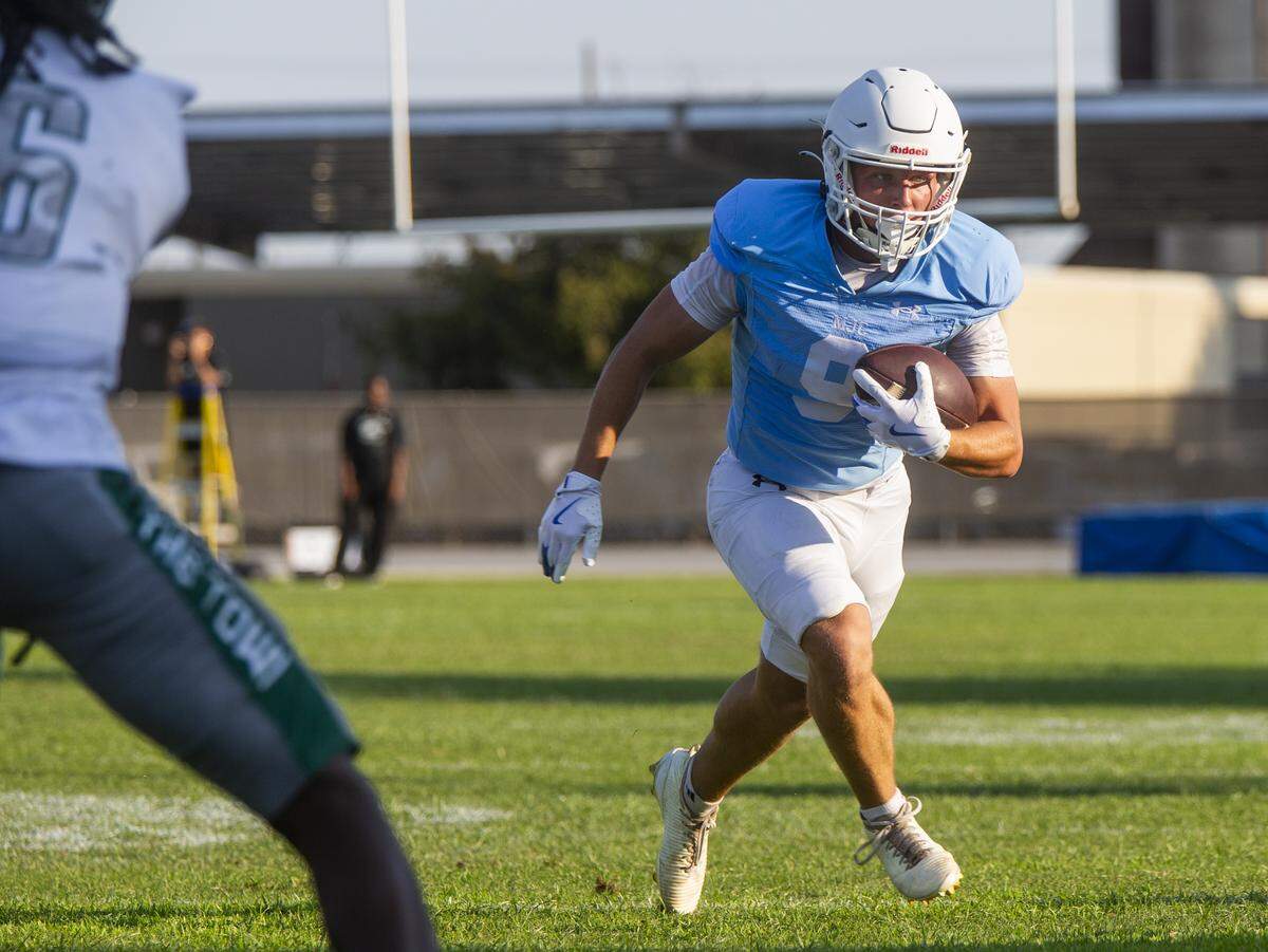 Modesto JC wide receiver Caden Bailey, 9, works his way upfield during the first half of a nonconference game against Laney College at Modesto Junior College on Saturday, Aug. 30, 2025.