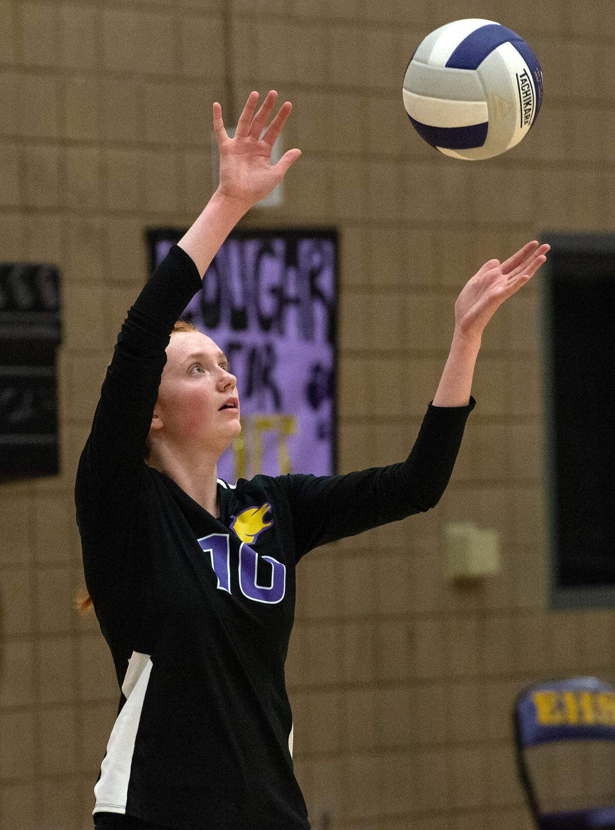 Escalon’s Rylie Lattig serves the ball during a non-league match with Downey in Escalon, Calif., on Tuesday, September 27, 2022.