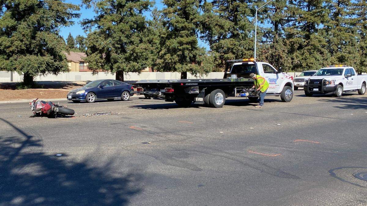 A motorcycle lies Oct. 14, 2021, on Standiford Avenue following a collision with a pickup truck. Modesto Police said the motorcyclist is expected to survive moderate-to-major injuries sustained in the crash.