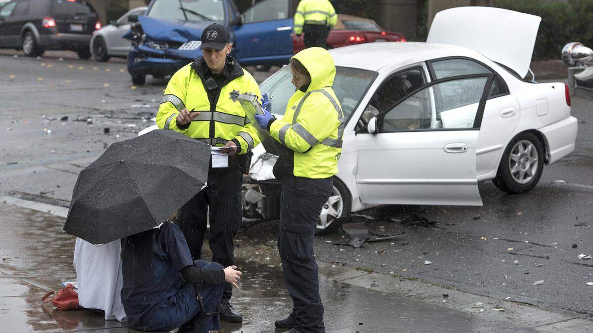 Modesto Police and AMR question accident victims in a four-vehicle collision on Orangeburg Avenue in Modesto, Calif., on Thursday, Nov. 16, 2017.