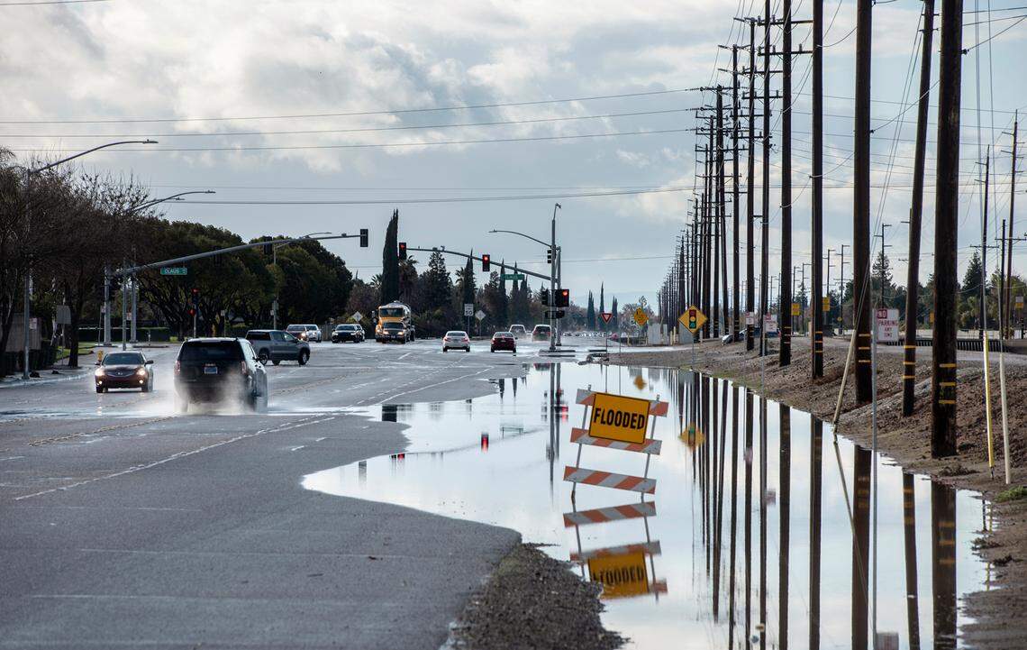 Flooding along East Briggsmore Avenue in Modesto, Calif., on Monday, Dec. 27, 2021.