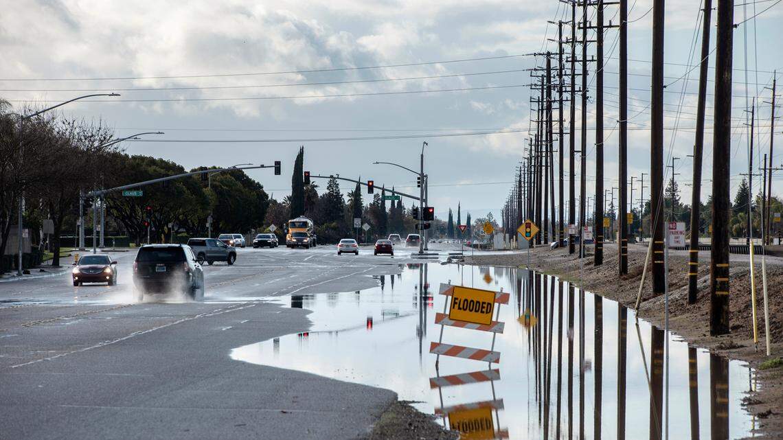 Flooding along East Briggsmore Avenue in Modesto, Calif., on Monday, Dec. 27, 2021.