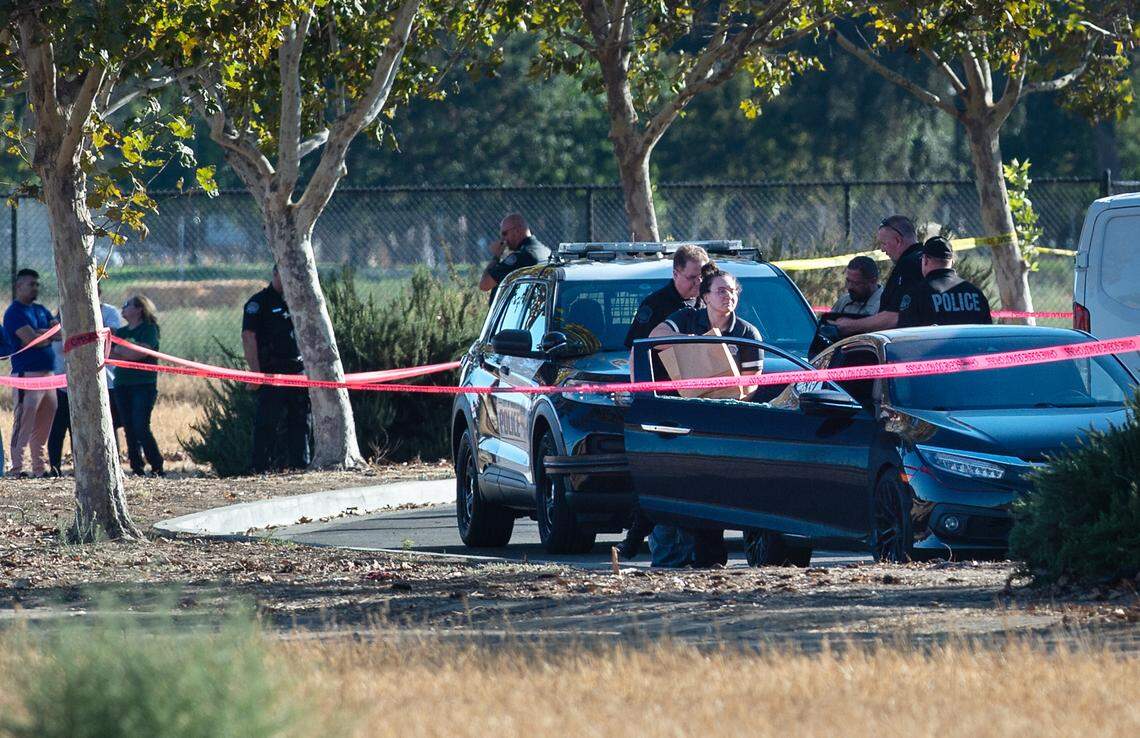Modesto Police investigate a death in the parking lot of St. Stanislaus Catholic Church on Maze Boulevard in Modesto, Calif., on Saturday, September 24, 2022.