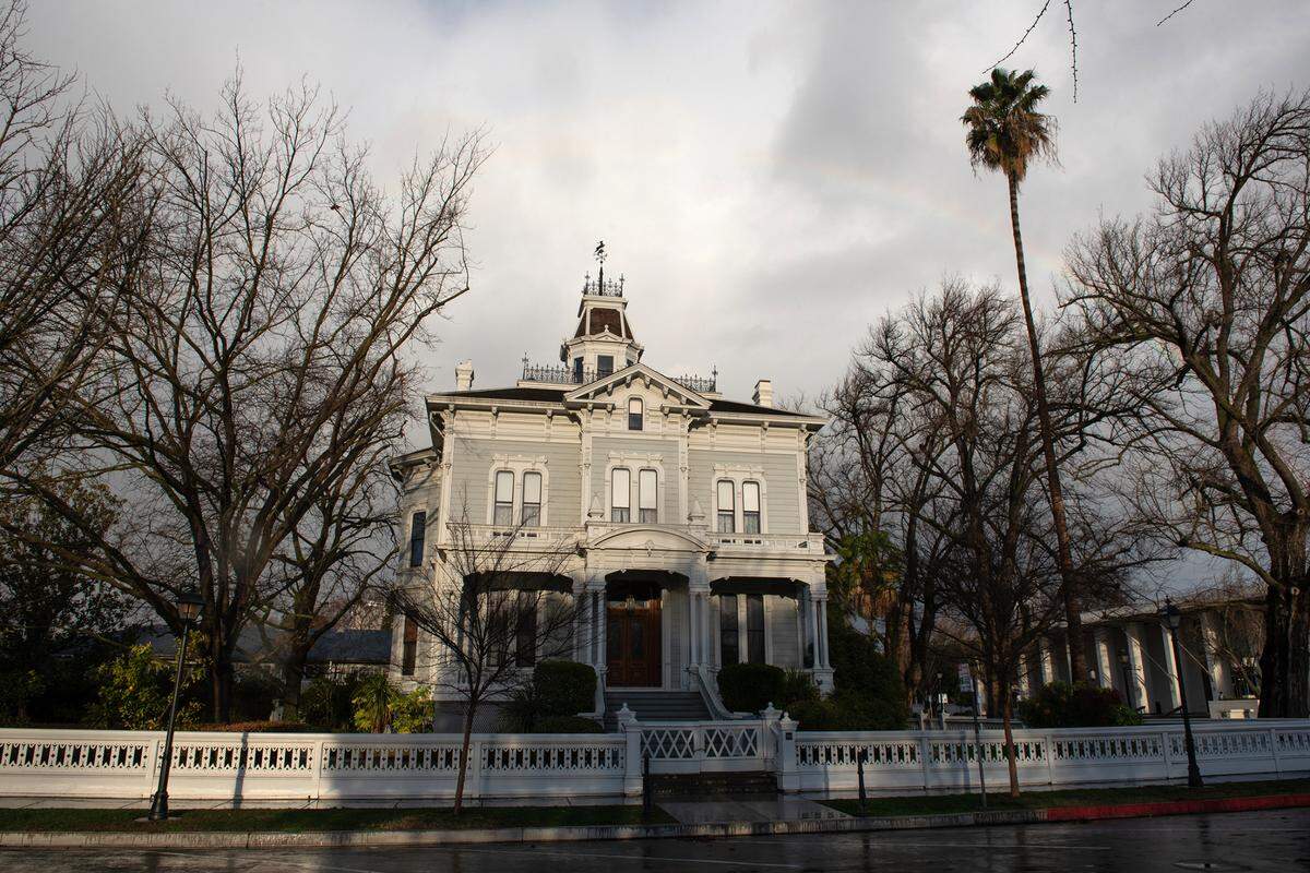 McHenry Mansion is lit by the sun during a break in the rain In Modesto, Calif., Tuesday, Jan. 10, 2023. 