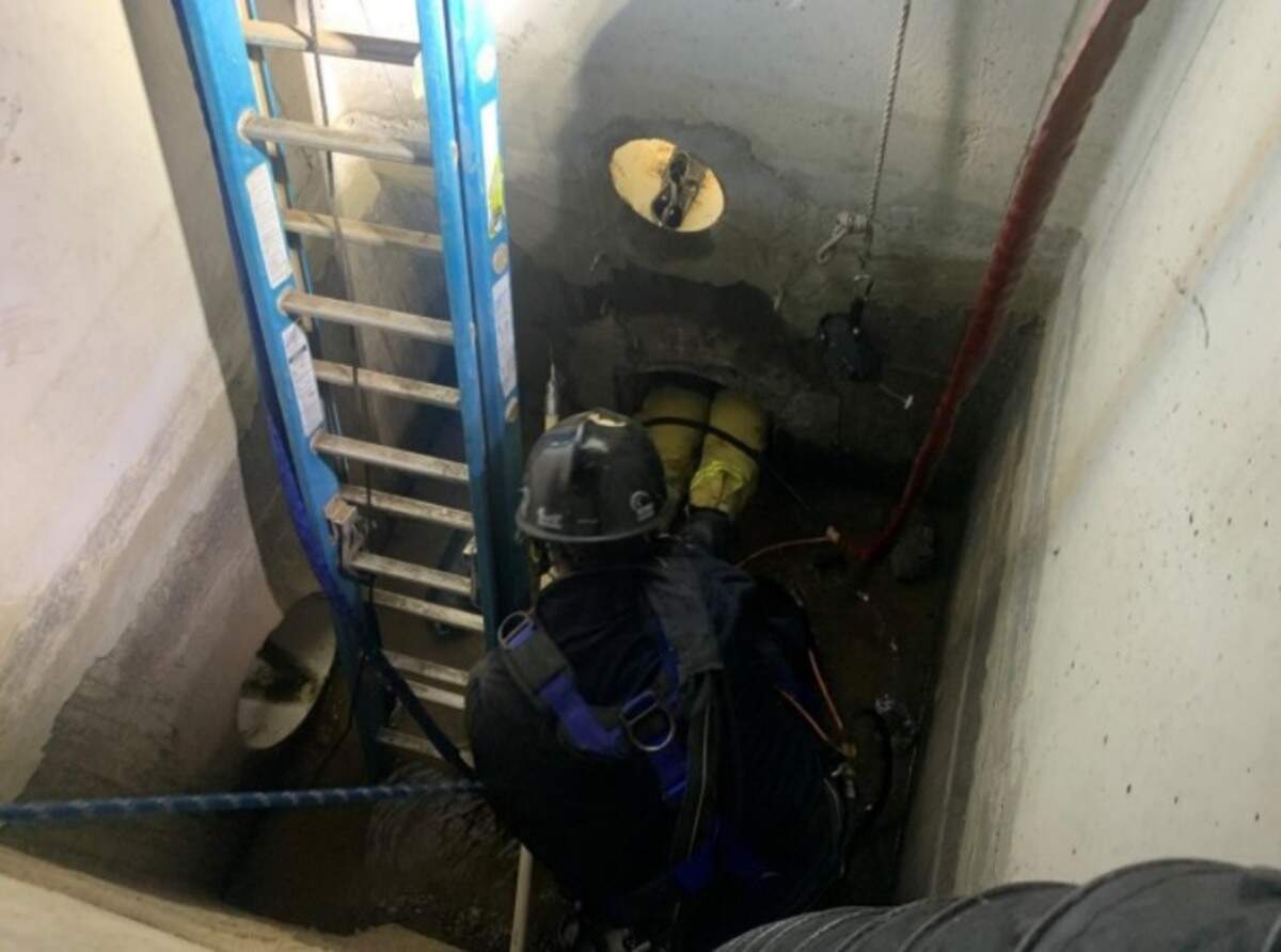 Firefighters rescued a dog from 50 feet within an irrigation pipe 8 feet below ground Saturday night in the Stanislaus County community of Valley Home. Modesto Fire Capt. Jason Fritz’s legs protrude form the pipe he had to wriggle into.