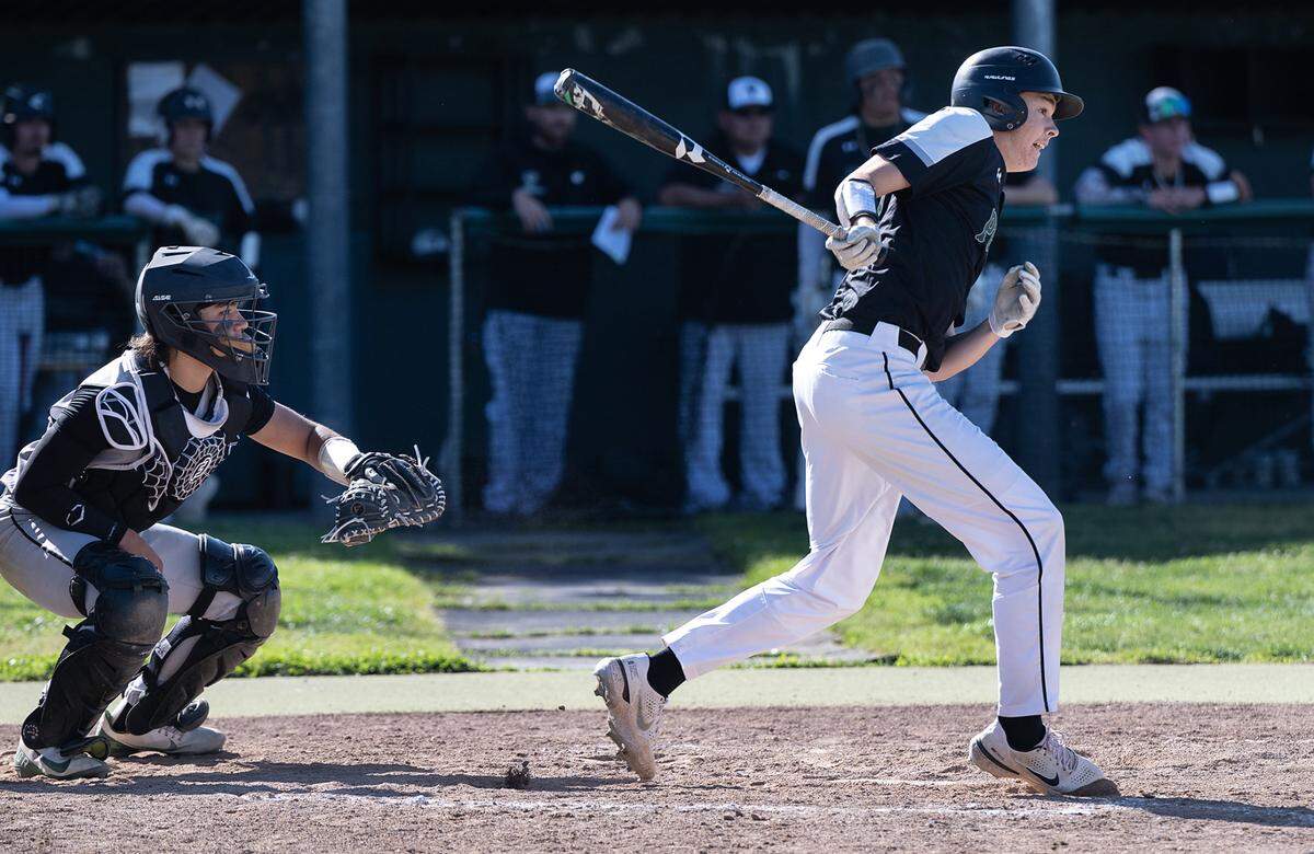 Pitman’s Drew Walker drives a ground ball during Sac-Joaquin Section Division 2 baseball playoff game with Rodriguez at Pitman High School in Turlock, Calif., Thursday, May 11, 2023.