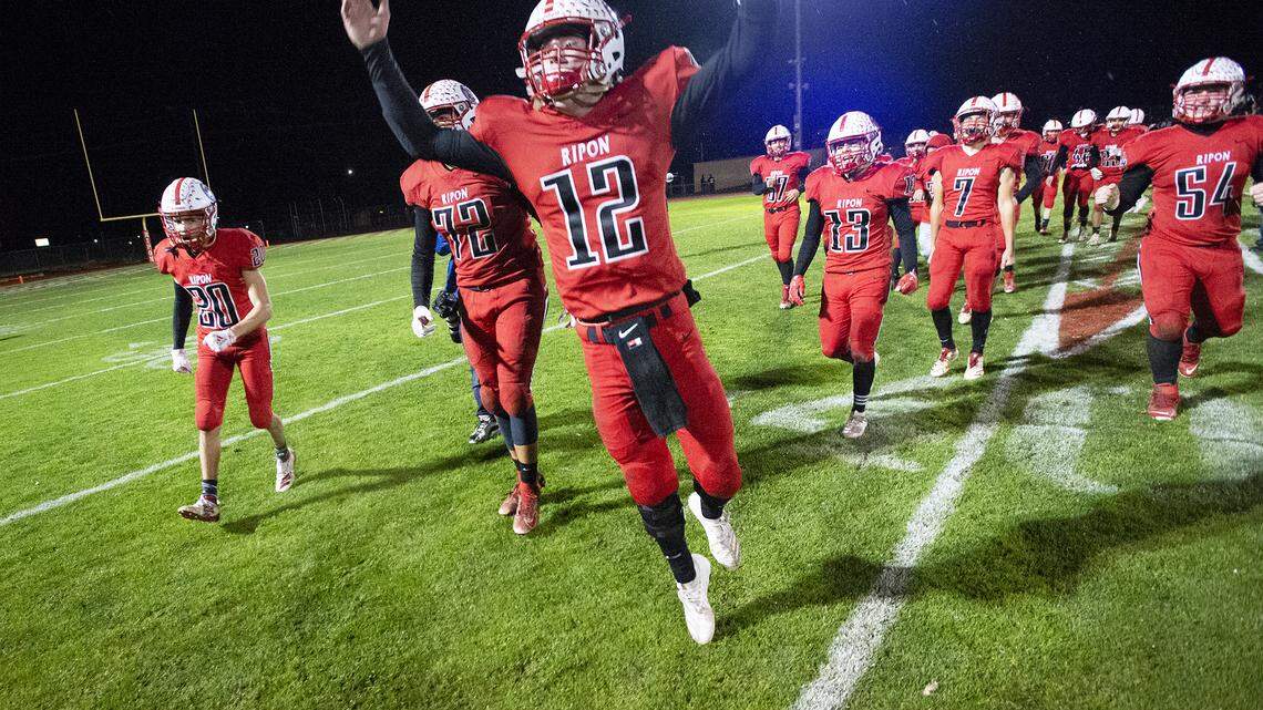 Ripon’s Nico Ilardi (12) celebrates victory over Highland with his teammates in the CIF State 4-AA championship game at Ripon High School in Ripon, Calif., on Saturday, Dec. 14, 2019.