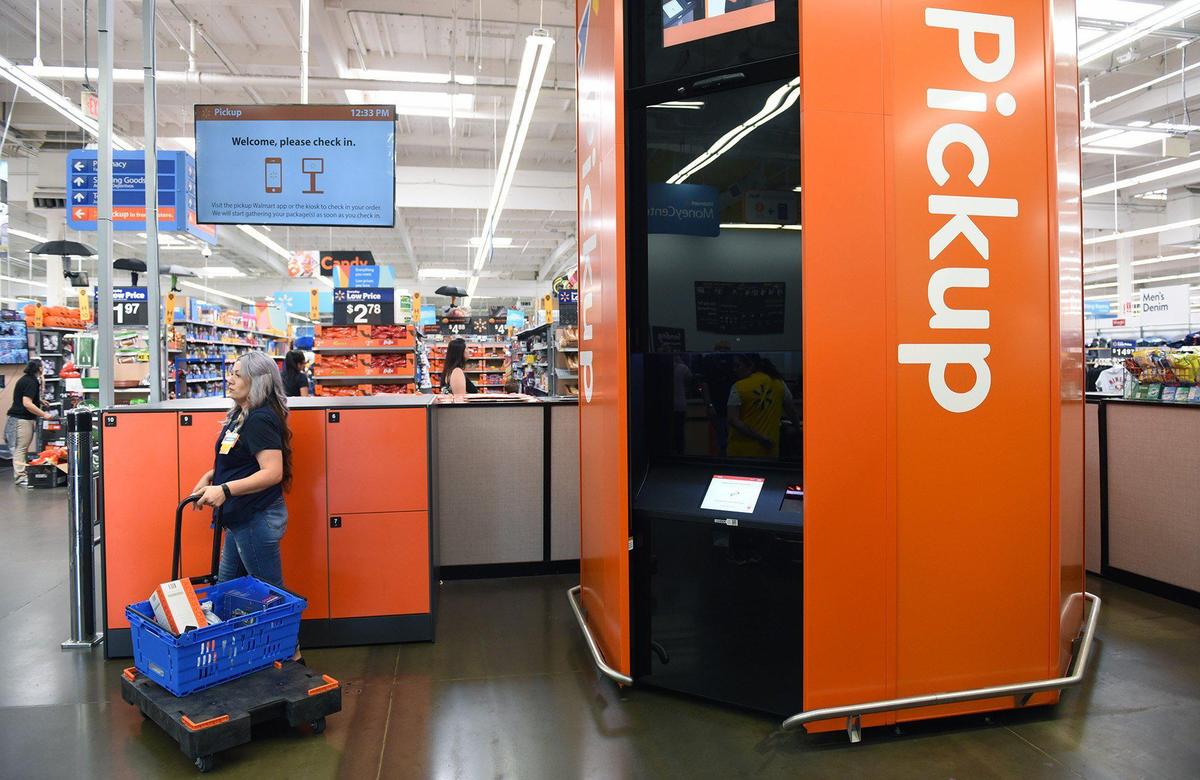 Department manager Amanda Arriaga prepares items at the pickup tower Friday afternoon September 13, 2019 at the McHenry avenue Walmart in Modesto, Calif. New Walmart pickup towers allow guests to retrieve their online orders at fixed locations, instead of home delivery.