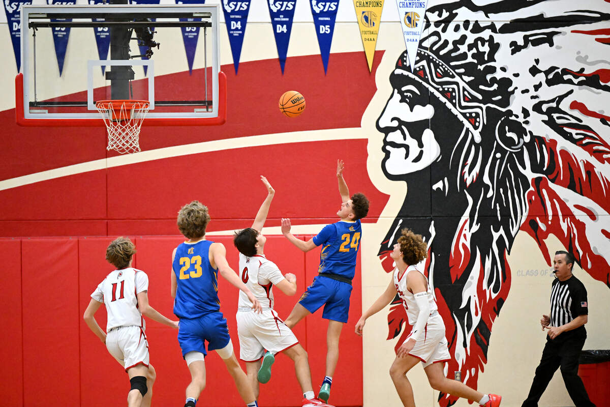 Ripon Christian’s Jake Vander Veen scores on a layup during the Trans Valley League game with Ripon at Ripon High School in February 2024.
