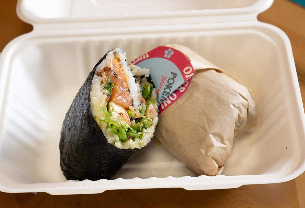 Salmon and tofu poke burrito made with a seaweed wrap at the new Pokémoto Hawaiian Poké restaurant in Village One Plaza in Modesto, Friday, March 28, 2025.