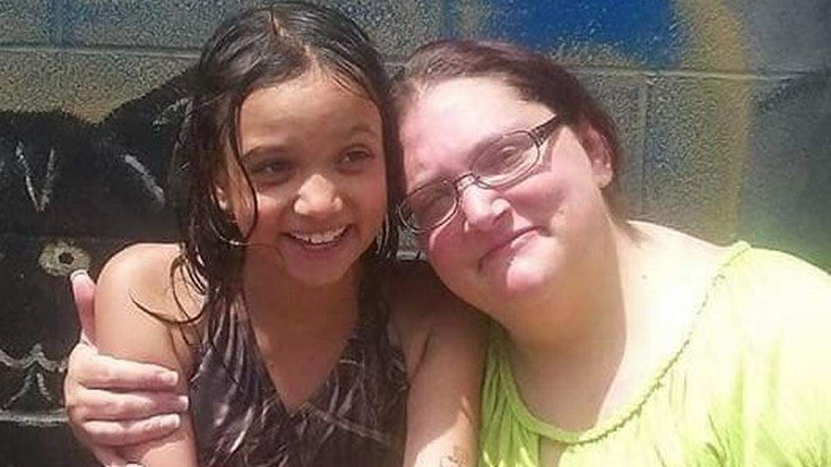 Stephanie Modena embraces her daughter, Ariana, in this undated photography provided by family.