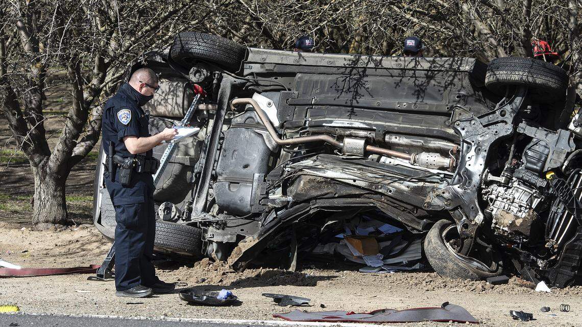 California High Patrol officers investigate a fatal collision at the intersection of Faith Home Road and Keyes Road in Keyes, Calif., on Saturday, Feb. 13, 2021.
